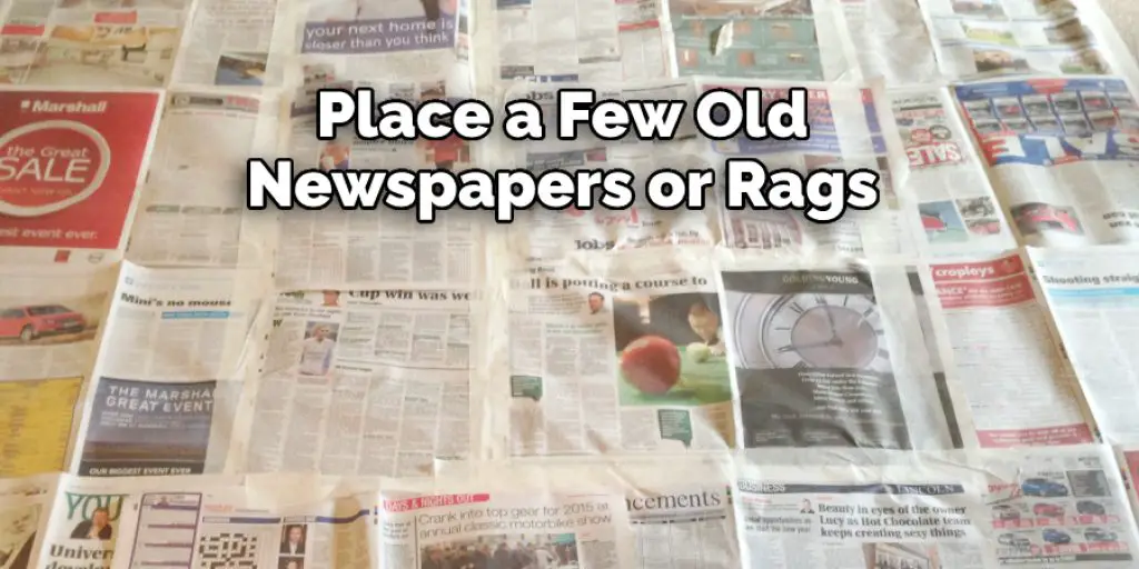  Place a Few Old Newspapers  or Rags on the Ground